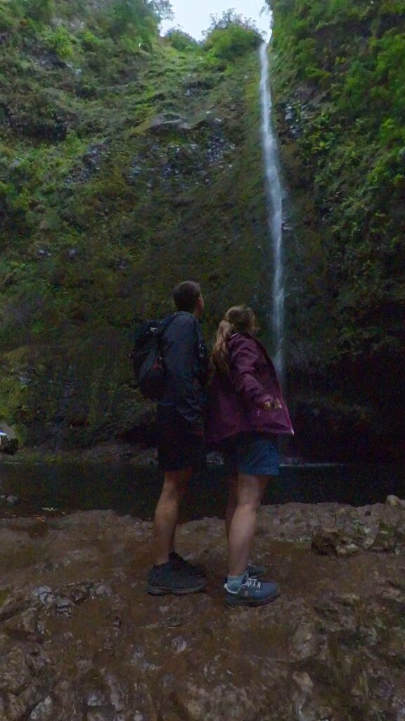 The final point of the levada do calderao verde, a towering waterfall in a round basin
