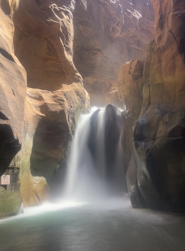 Waterfall at the end of the Siq trail in Wadi Mujib - a refreshing stop on this Jordan itinerary
