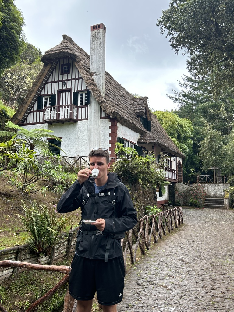 Rudy drinking a cup of coffee before starting day 3 on this Madeira itinerary